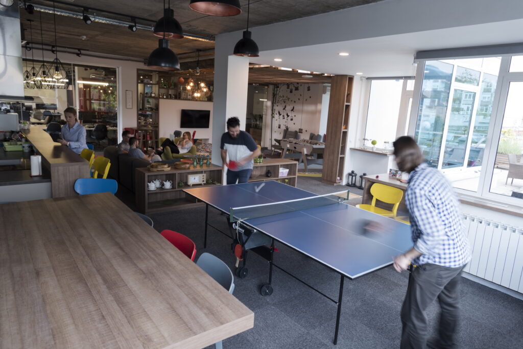 playing ping pong tennis at creative office space